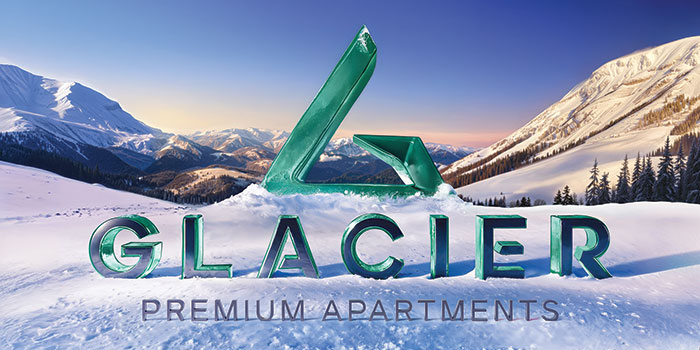 Glacier Premium Apartments — winter landscape with snow and mountains, green logo set against snowy slopes.