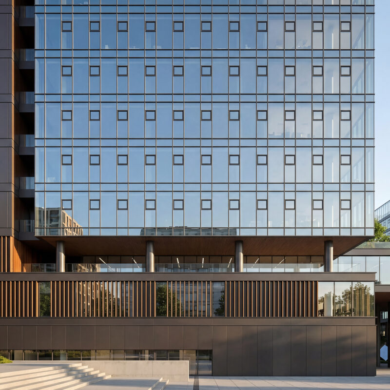 Modern office building facade architectural visualization with glass curtain wall and structural grid.